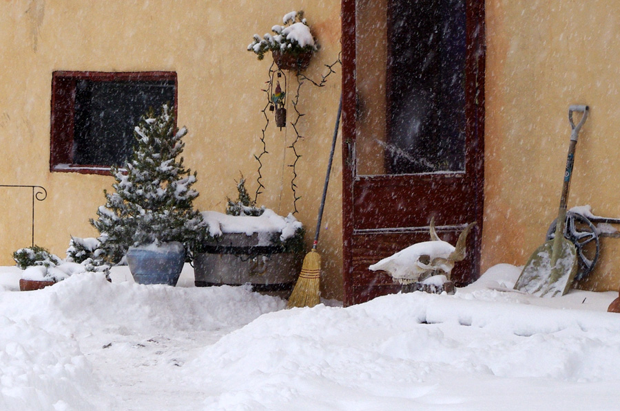 front door of an old adobe in the snow