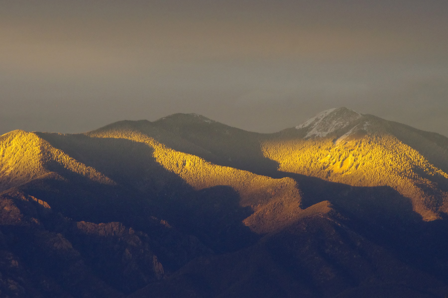 Last sunset light on Taos Mountain on a winter evening