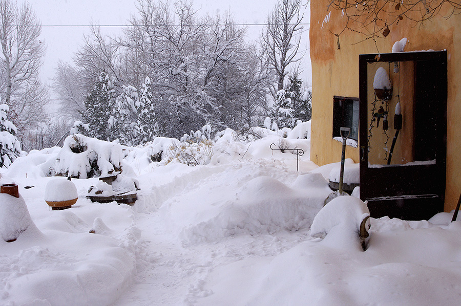snowy shot of old adobe in Taos, NM