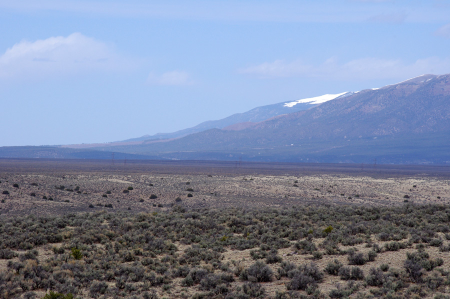 mesas and mountains stretching north from Taos