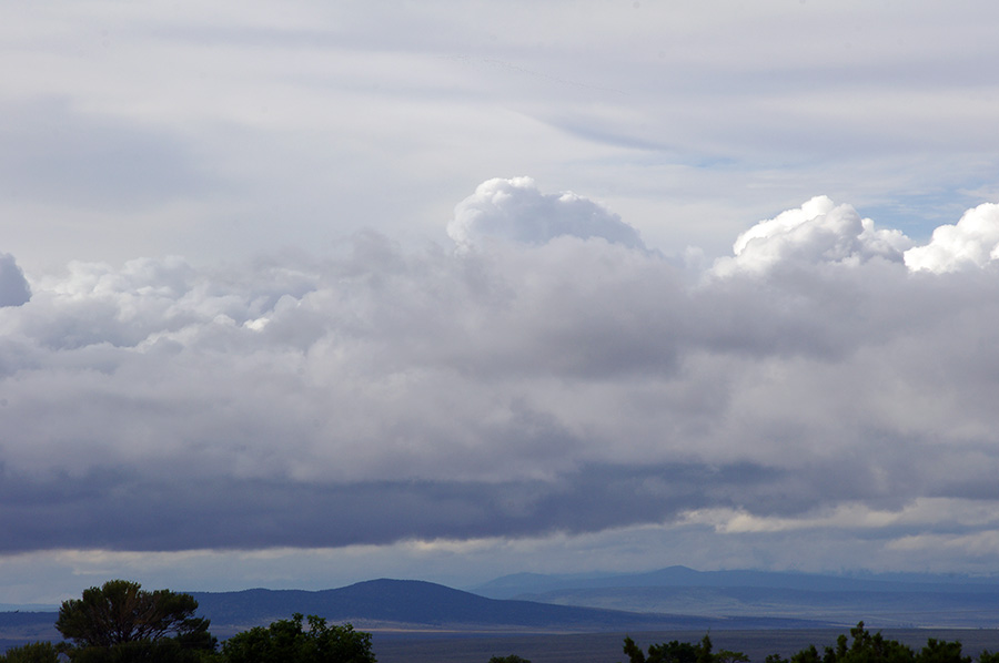 clouds sweeping over the rift valley west of Taos, NM