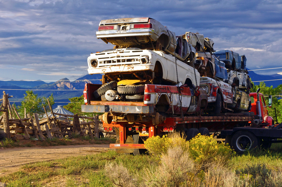 trailer of junked cars