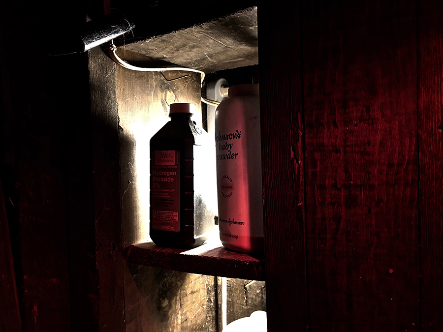 bathroom shelf in rotting old adobe