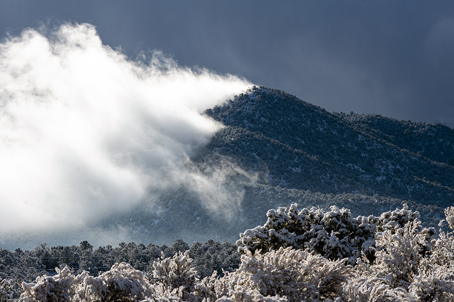 clouds ripping over the peaks