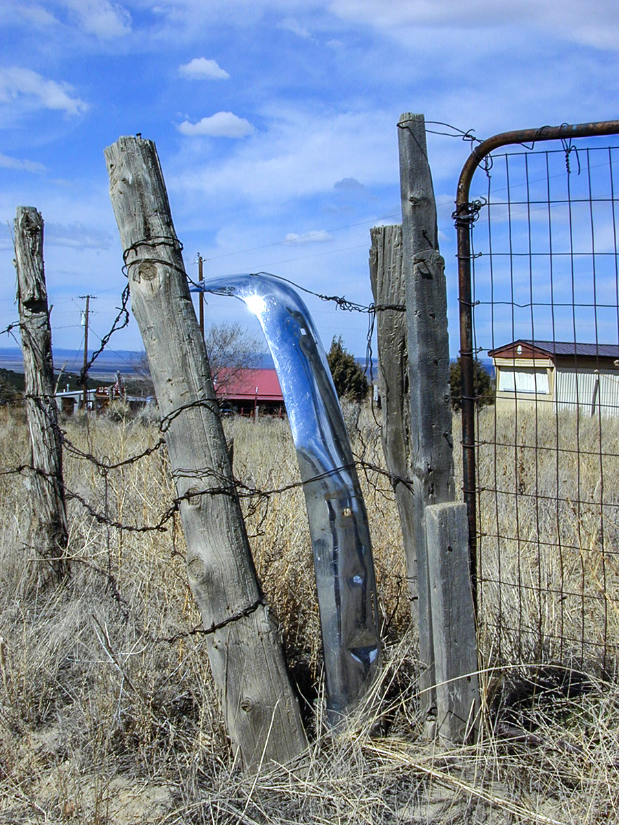 San Cristobal scene, bumper used as fencepost