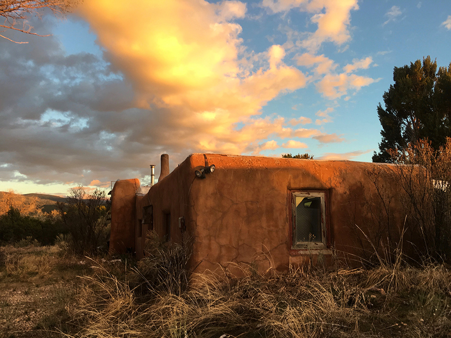 adobe house at sunset in Taos, NM