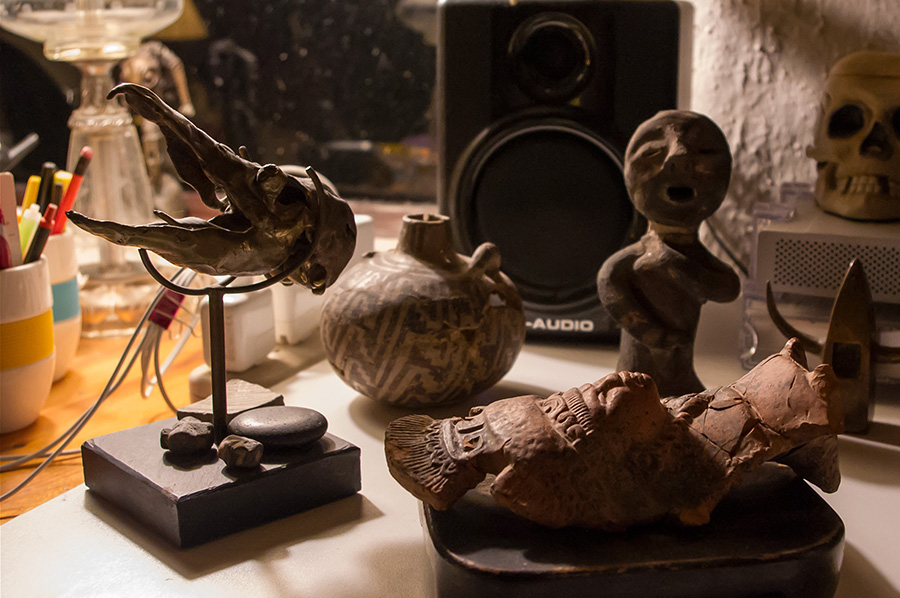 Native artifacts and sculptures on my desk